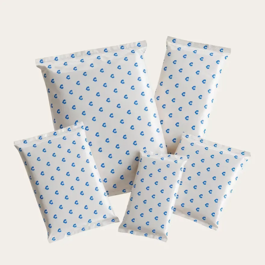 Five refrigerant gel packs in printed pillow pouches, fanned out.
